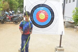 Kindergarten student learning Archery Training at RISHS International School, Chennai
